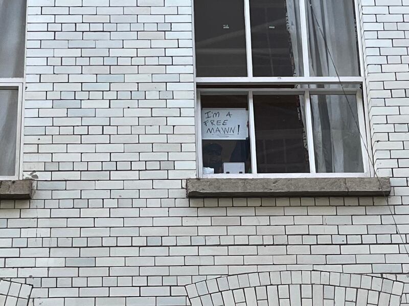 Sign in Conway Mill, Belfast, where Kneecap are due to hold a press conference reads: 'I'm a free mawn' Photo by Seanín Graham