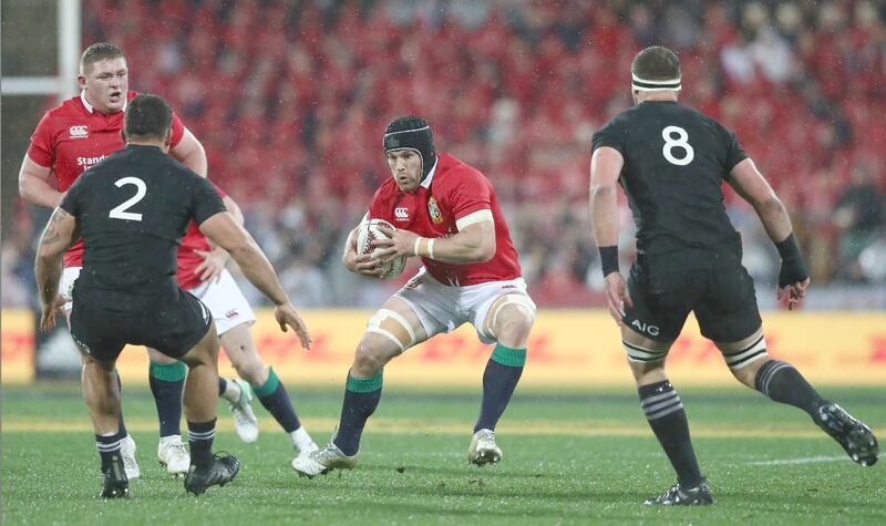 Sean O'Brien charges towards All Blacks Codie Taylor and Kieran Read. Photograph David Rogers/Getty Images