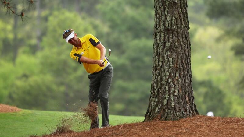 David Lynn of England hits his second shot on the 15th hole during the first round of the 2013 Masters. Photograph: Mike Ehrmann/Getty Images