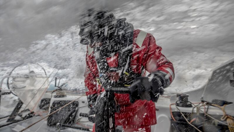 Ice-cold water  over the deck of Scallywag on Leg Seven  from Auckland to Itajai, and John Fisher  (Fish) standing firm