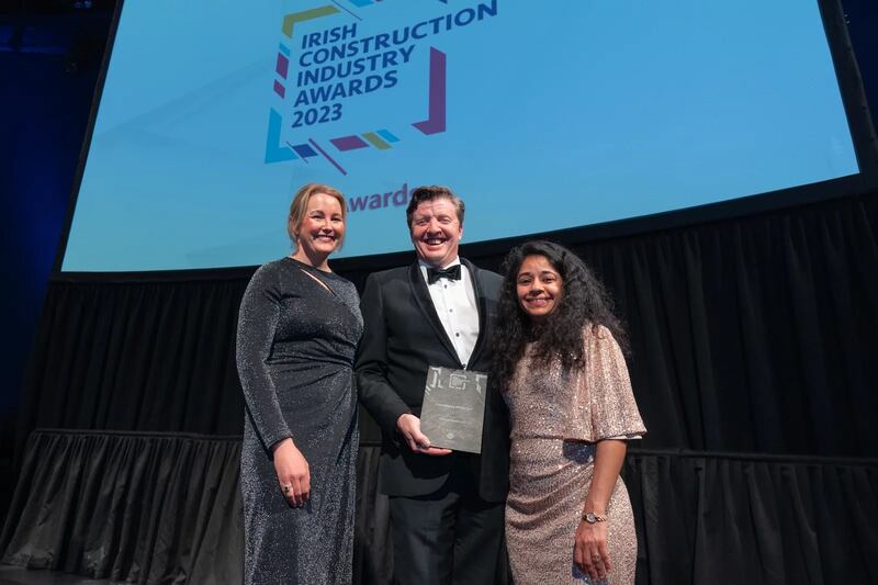 Mark Dunne, director of Globoserv, presents the consultancy of the year award to Lisa Cleary and Saba Pathan, Mitchell McDermott