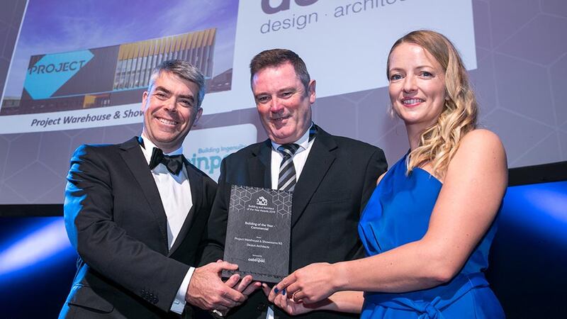 Martin Murray, Sales and Business Development Manager, Cabinpac presents the Building of the Year - Commercial award to Mícheál de Siún & Florian Leavy, Desiun Architects.