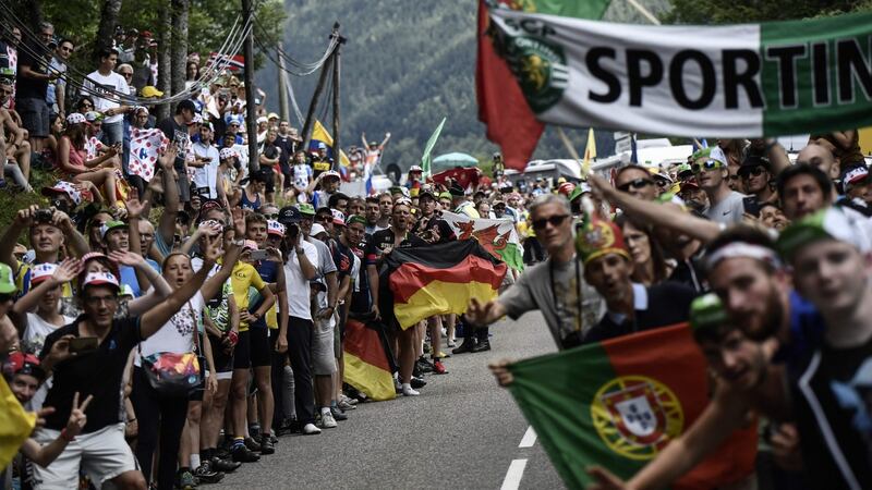 “Being the French national day, the fans were out in their tens of thousands, lining the route, drinking, eating, yelling and doing Mexican waves as we passed.” Photograph:  Jeff Pachoud/AFP/Getty Images