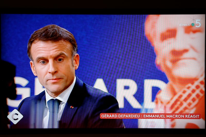 A television screen broadcasting French TV channel France 5 in December 2023 as French president Emmanuel Macron speaks. Photograph: Ludovic Marin/AFP