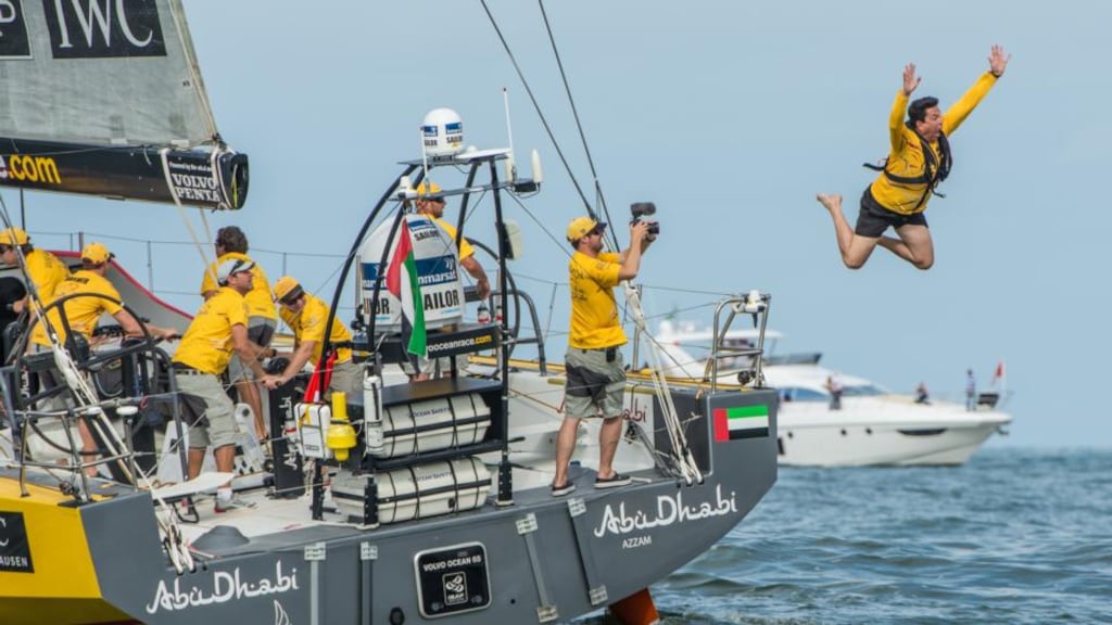 British comedian Dom Joly jumps from onboard Abu Dhabi Ocean Racing during the start of leg six from Itajaí in Brazil to Newport in Rhode Island. Photograph: Getty Images