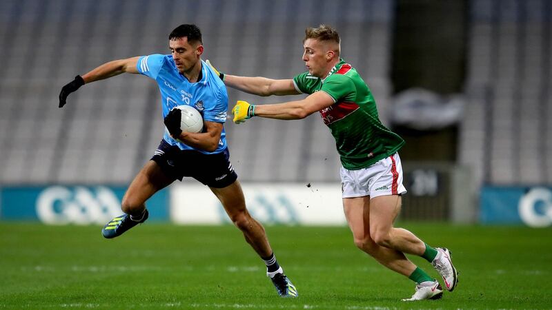 Dublin’s Niall Scully is challenged by  Eoghan McLaughlin of Mayo during the All-Ireland Final at Croke Park. Photograph: Ryan Byrne/Inpho