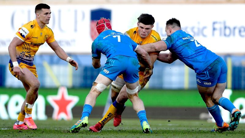 Exeter’s Dave Ewers is tackled by Josh van der Flier and Rónan Kelleher of Leinster during the Heineken Champions Cup quarter-final at Sandy Park. Photograph: Ryan Hiscott/Inpho
