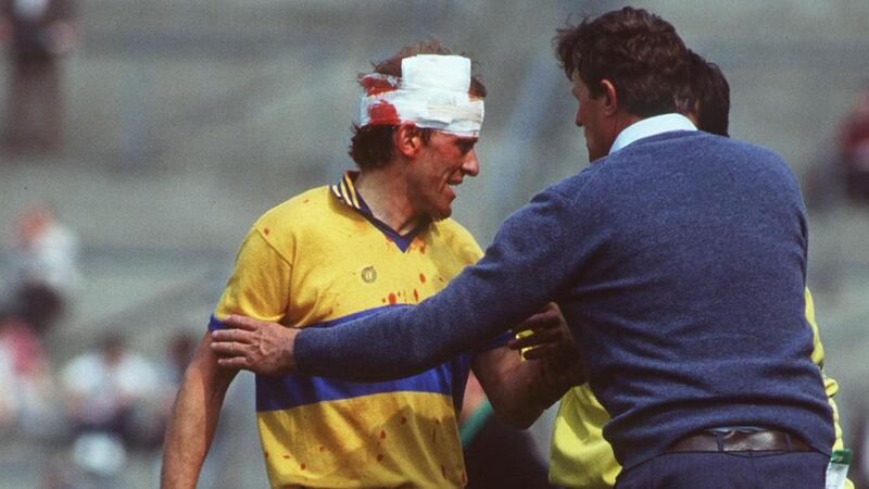 An injured Ger Loughnane during a game in 1984. Photograph: Billy Stickland/Inpho