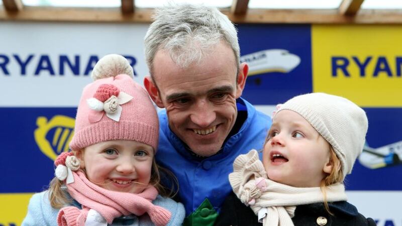 Jockey Ruby Walsh with his daughters Isobel (left) and Elsa after winning the Ryanair Hurdle on Hurricane Fly.