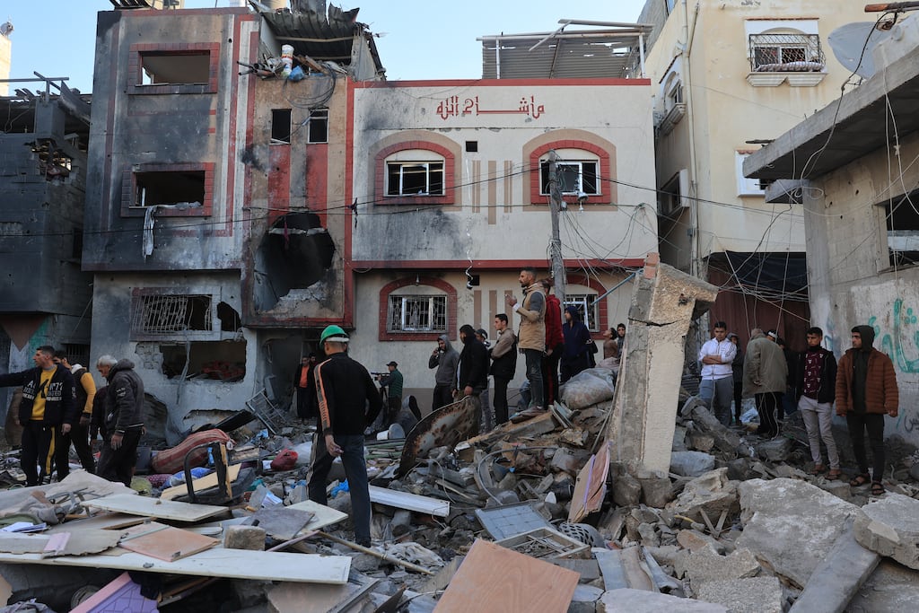 Palestinians check the damage outside a house in which a man and his daughter were killed and others wounded, during an early morning Israeli strike in Rafah in the southern Gaza Strip on December 9th. Photograph: Said Khatib/Getty Images