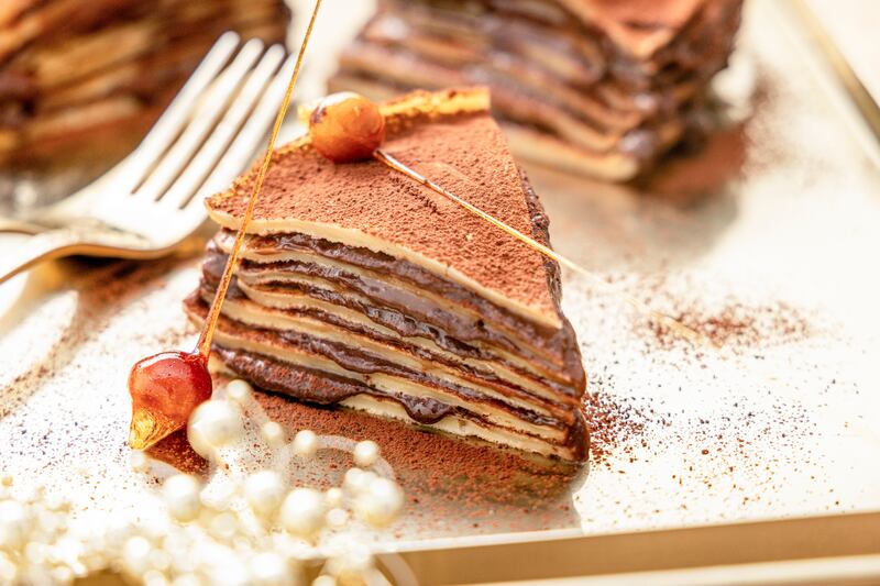 Chocolate, hazelnut and peanut butter crepe cake with candied hazelnuts. Photograph: Harry Weir