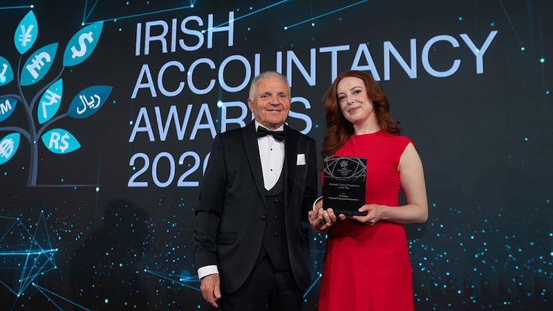 Brendan Howard, managing director at Mercia, presents the graduate training programme of the year award to Sarah Kavanagh, EY Ireland