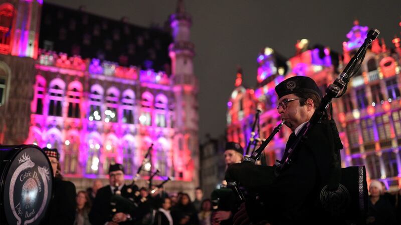 Members of the Celtic Passion Pipe Band playing in Grand Place in Brussels on Thursday night. Photograph: SYui Mok/PA Wire