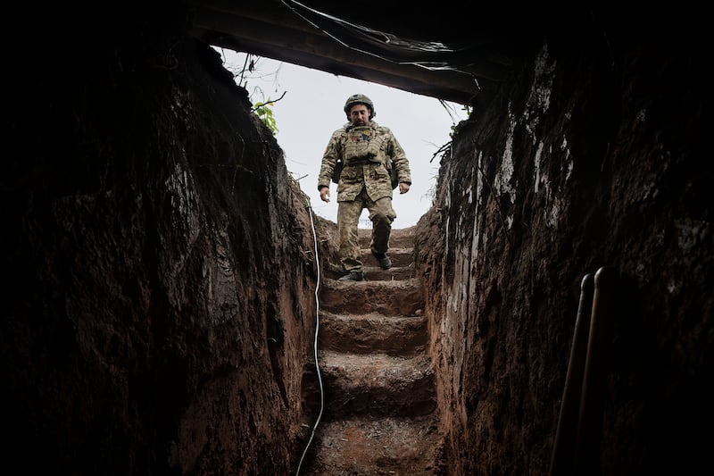 A Ukrainian soldier enters a trench at an artillery position in the Donetsk region in April 2024. Photograph: Tyler Hicks/The New York Times