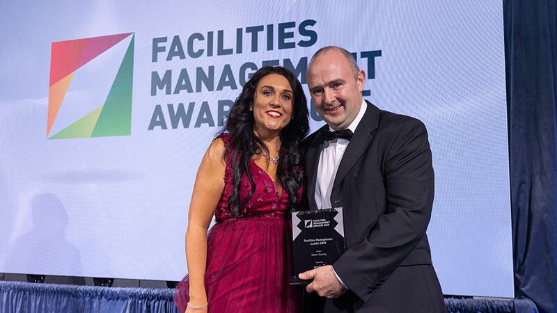Sarah Hunt, head of HR at Sodexo Ireland, presents the facilities management leader 2025 award to Conor Cooney, Arup