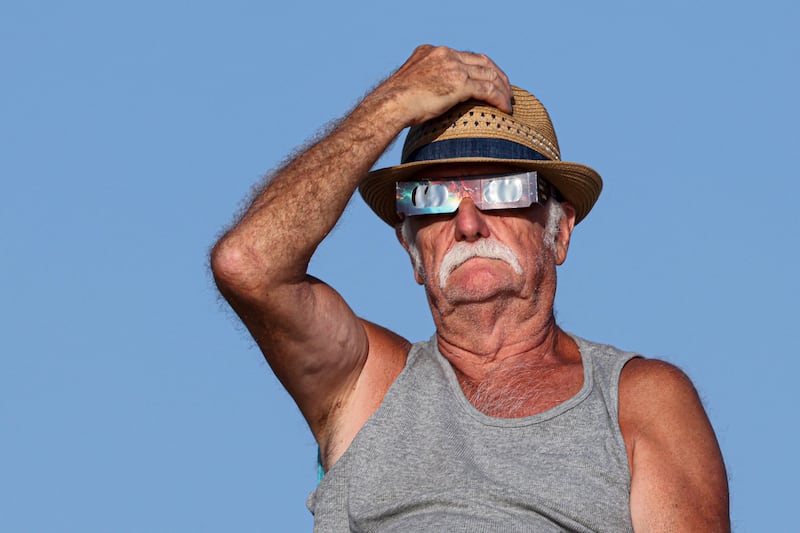 Watching the eclipse on the Noirmoutier island, west of France. Photograph: Ludovic Marin/AFP via Getty Images