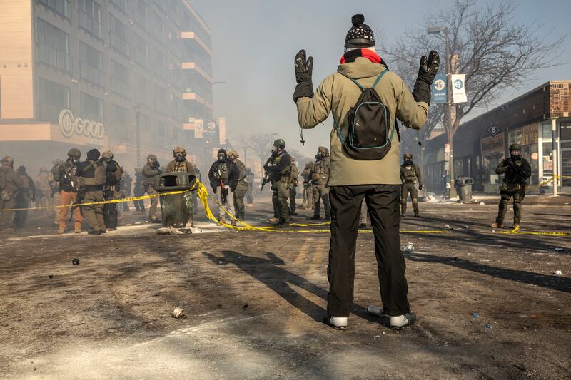 Federal agents block off streets as protesters gather for a rally in Minneapolis, on Saturday. Photograph: David Guttenfelder/The New York Times