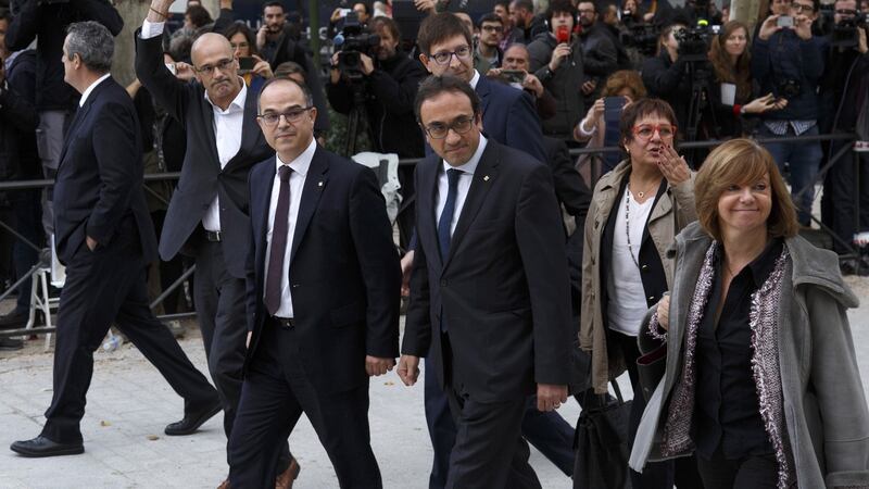 Former members of the Catalan government (left to right): Joaquin Forn, Raul Romeva, Josep Rull, Carles Mundo, Jordi Turull, Dolors Bassa and Meritxel Borras arrive at Spain’s National High Court today in Madrid, Spain. Along with ousted president Carles Puigdemont they  were ordered to appear  on  charges of rebellion, sedition and misuse of public funds following  the unilateral declaration of independence. Photograph: Pablo Blazquez Dominguez/Getty Images