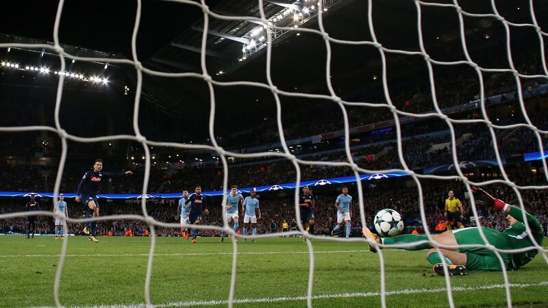 S Manchester City’s Ederson saves a penalty from Napoli’s Dries Mertena. Photograph: Jason Cairnduff/Reuters