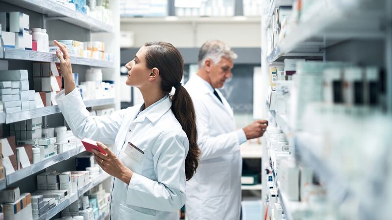 Pharmacists checking products while working  in a dispensary