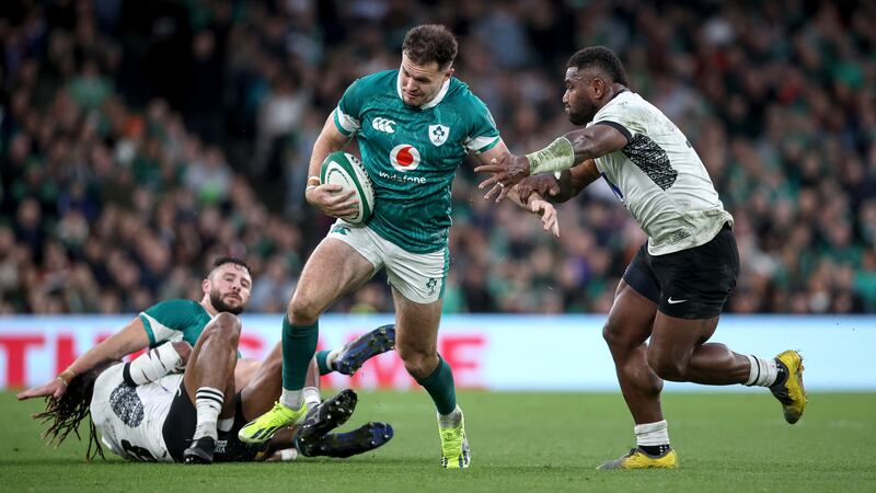 Jacob Stockdale with Fiji's Josua Tuisova. Photograph: Ben Brady/Inpho