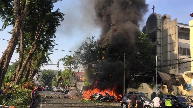 Motorcycles burn following a blast at the Pentecost Church Central Surabaya  in Surabaya on Sunday. Photograph: AFP