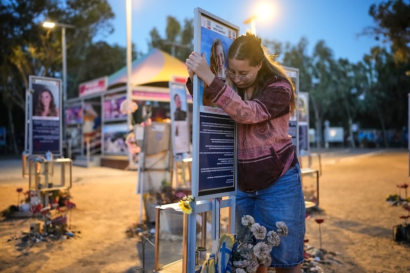 Raz Zarfati, whose sister Ron Zarfati was killed in the October 7th, 2023, attack, visits a memorial at the Nova music festival site. Photograph: Ohad Zwigenberg/AP