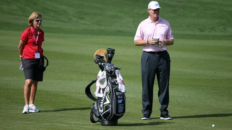 Dr Sherylle Calder working with Ernie Els at the  Qatar Masters at The Doha Golf Club. Photograph: Ross Kinnaird/Getty Images