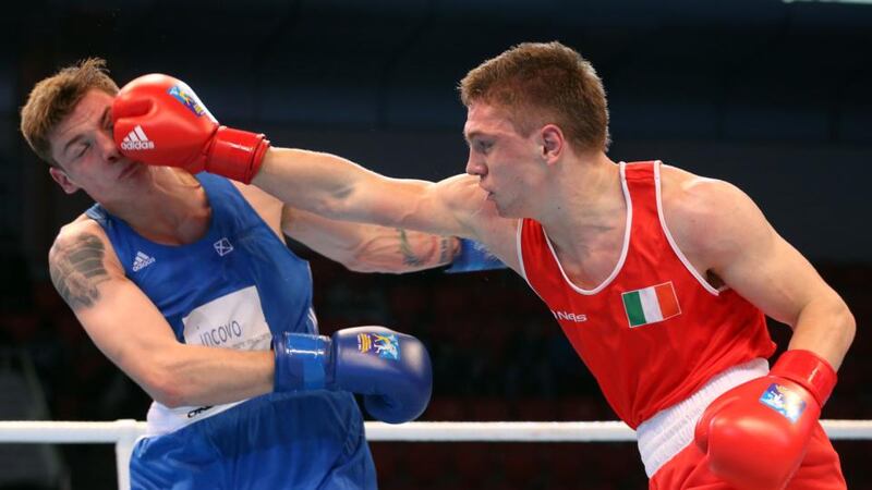 Ireland’s Jason Quigley (right) lands a blow on  Aston Brown of Scotland in Almaty. Photograph: Cathal Noonan/Inpho