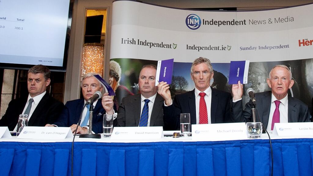 Stare-out:  INM chief executive Robert Pitt (far left) and chairman Leslie Buckley (far right) at the Independent News & Media agm at the Westbury Hotel in Dublin.  Photograph: Gareth Chaney Collins