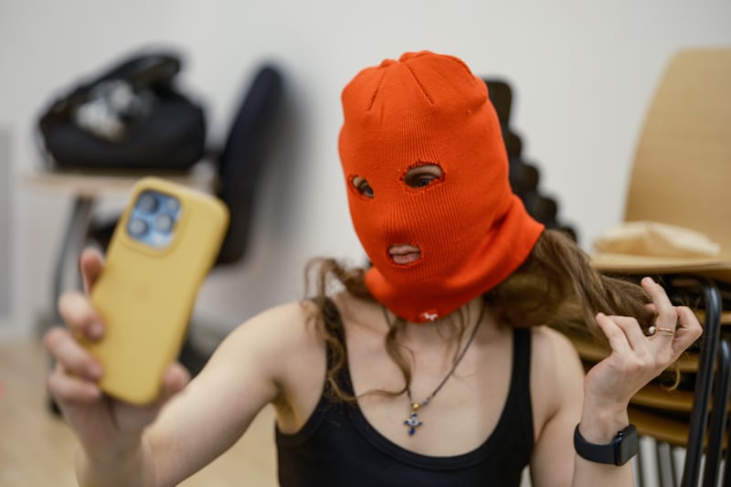 Maria Alyokhina prepares her balaclava ahead of a pro-democracy protest in Washington Square Park on April 2nd in New York City. Photograph: Misha Friedman/Getty Images