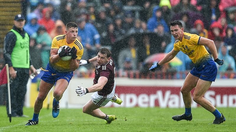 Conor Cox and Tadgh O’Rourke goe past Thomas Flynn. Photo: Tommy Grealy/Inpho