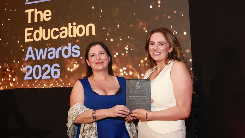 Claire Woods, awards judge, presents the best collaboration award - domestic (economic, digital & workforce development) award to Ellen Curtin, Gaelchultúr & MSLETB