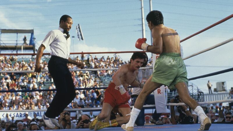 Referee Richard Steele looks on as Irish boxer Barry McGuigan goes down during his defeat to Steve Cruz in the WBA world featherweight title fight against Steve Cruz  at Caesars Palace, Las Vegas in 1986. Photo: Mike Powell/Getty Images