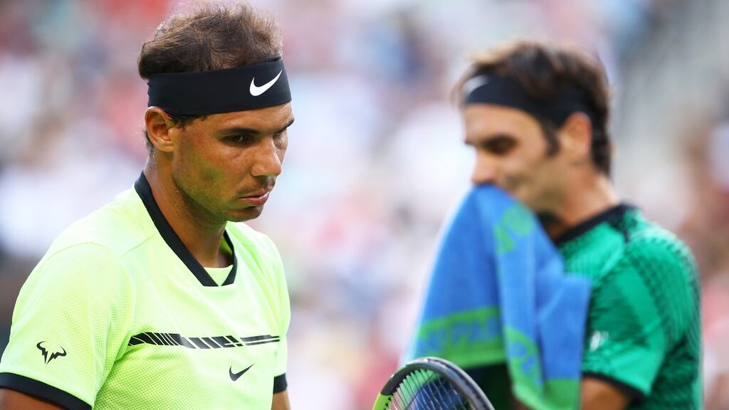 Roger Federer and Rafa Nadal: two titans could be poised to meet in the semi-final of the US Open. Photograph:  Clive Brunskill/Getty Images