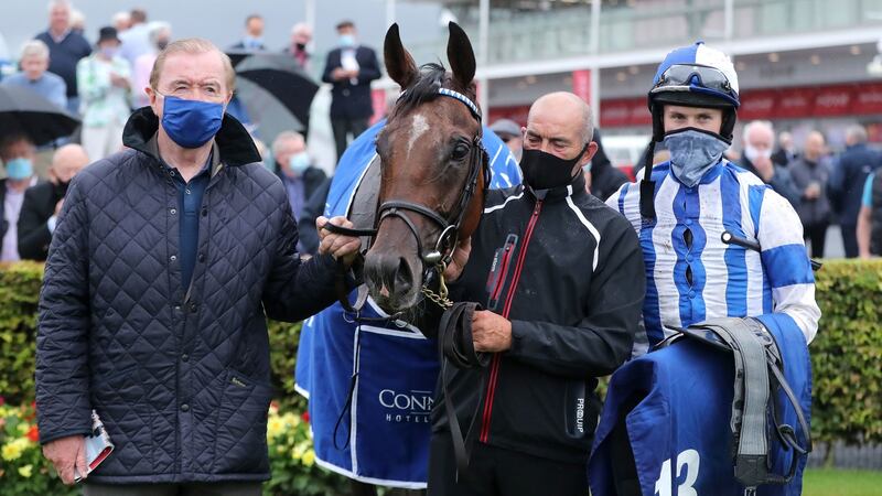 Colter with trainer Dermot Weld  and jockey Finian Maguire after winning the Connacht Hotel Handicap. Photograph: Niall Carson/PA Wire
