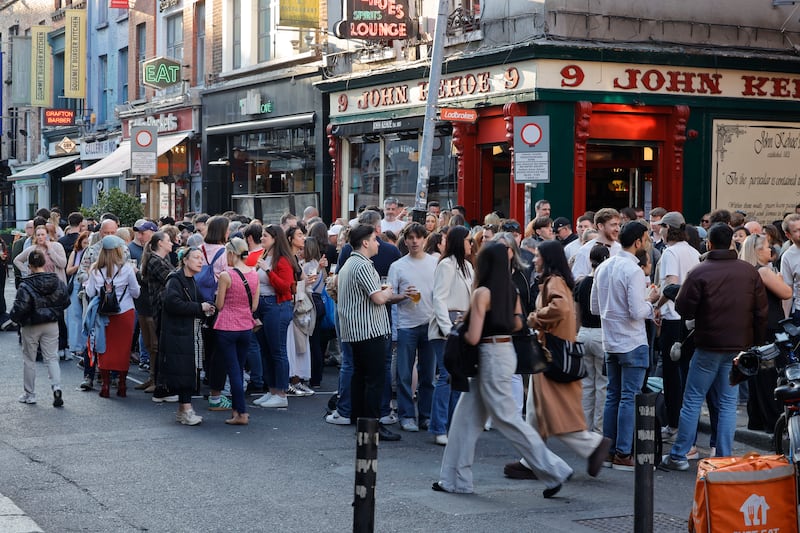 People enjoy warm weather, alfresco dining and beverages outside Kehoe's pub on South Anne street. Photograph: Alan Betson 