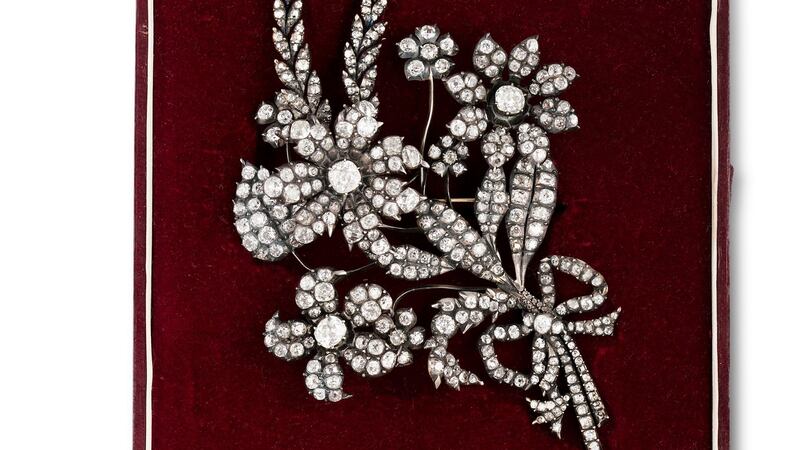 Lot 121,  a miniature bouquet tied with a carefree diamond bow
