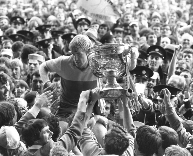 Kerry captain Jimmy Deenihan with Sam Maguire amidst a sea of people after the 1981 final - only last weekend in Kildare town, GAA president Larry McCarthy unveiled a statue to Bill ‘Squires’ Gannon, who captained the county to the All-Ireland in 1928 and became the first man to be presented with the Sam Maguire. Photograph: Pat Langan