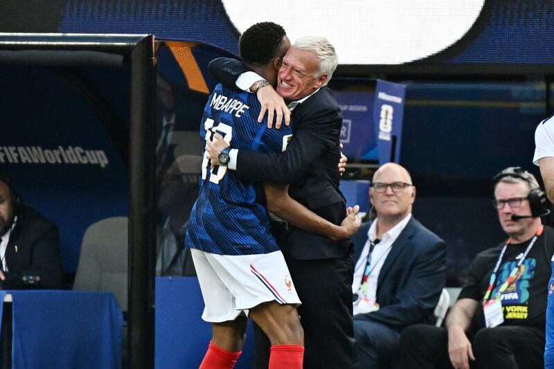 Kylian Mbappé celebrates with France head coach Didier Deschamps after scoring the opening goal against Sweden. Photograph: Jewel Samad/AFP via Getty Images
