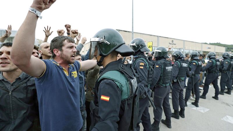 Officers of the Guardia Civil national police stand outside a polling centre  at Sant Julia Sports Centre in Barcelona on Sunday. Photograph: Andreu Dalmau/EPA