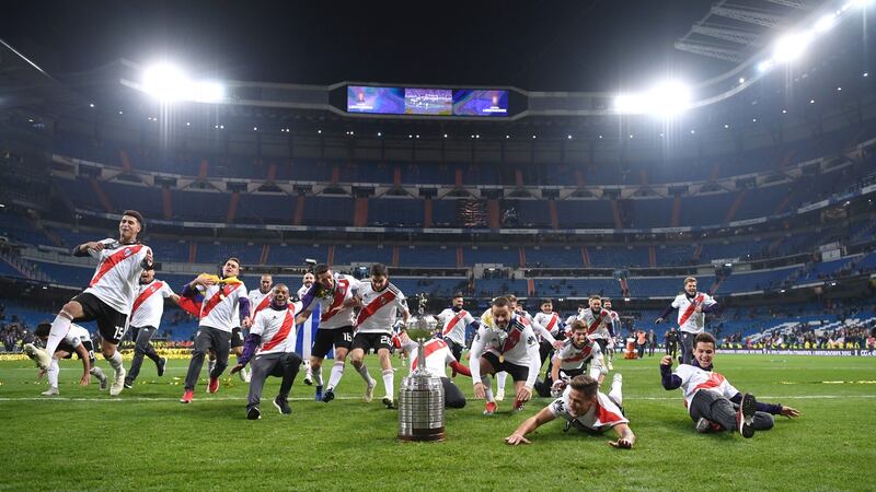 River Plate celebrate victory with the tophy after the second leg of the Copa Libertadores final against Boca Juniors. Photo: Laurence Griffiths/Getty Images
