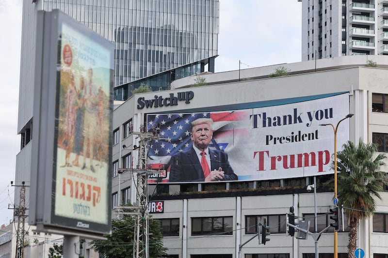 A billboard displays an image of US president Donald Trump with a message thanking him for reaching a ceasefire deal in Gaza, on the side of a building in Tel Aviv's Hostage Square. Photograph: Jack Guez/AFP via Getty Images         