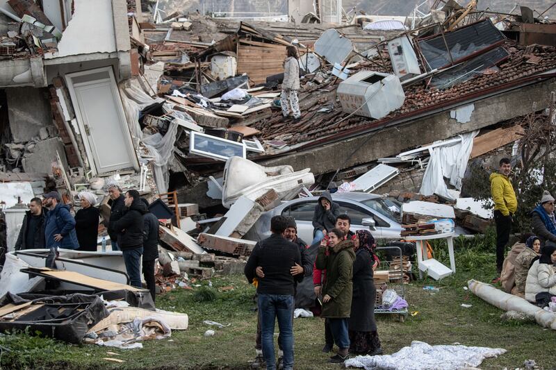 People wait for news of their loved ones, believed to be trapped under collapsed building in Hatay, Turkey. Photograph: Burak Kara/Getty Images
