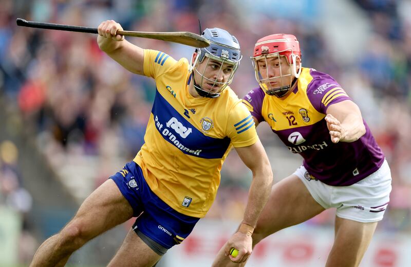 Clare's Cian Nolan and Lee Chin of Wexford. Photograph: James Crombie/Inpho

