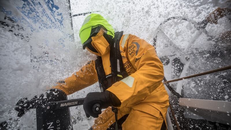 Annalise Murphy battles driving snow while working on a winch grinder aboard Turn the Tide on Plastic  during  leg  nine from Newport, Connecticut  to Cardiff. Photograph: Volvo Ocean Race