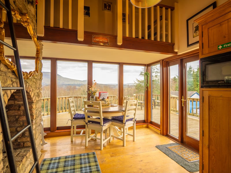 Kitchen dining area, with doors leading to the raised south-facing deck