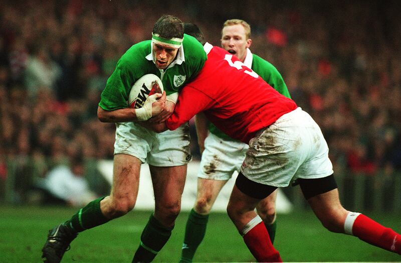 Paddy Johns of Ireland is tackled by Mark Rowley of Wales at Cardiff Arms Park on Saturday, February 2nd, 1997. Photograph: Frank Miller