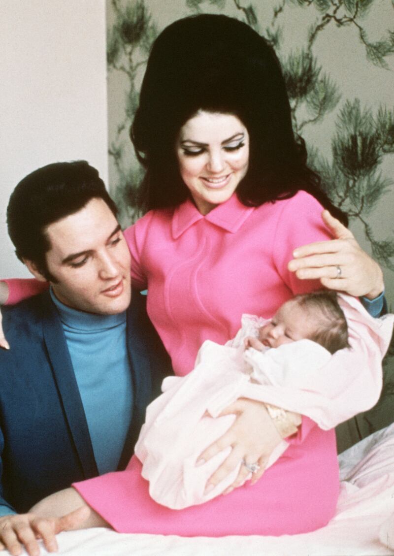 Newborn: Lisa Marie Presley as a baby with her parents, Elvis and Priscilla, in 1968. Photograph: Bettmann/Getty