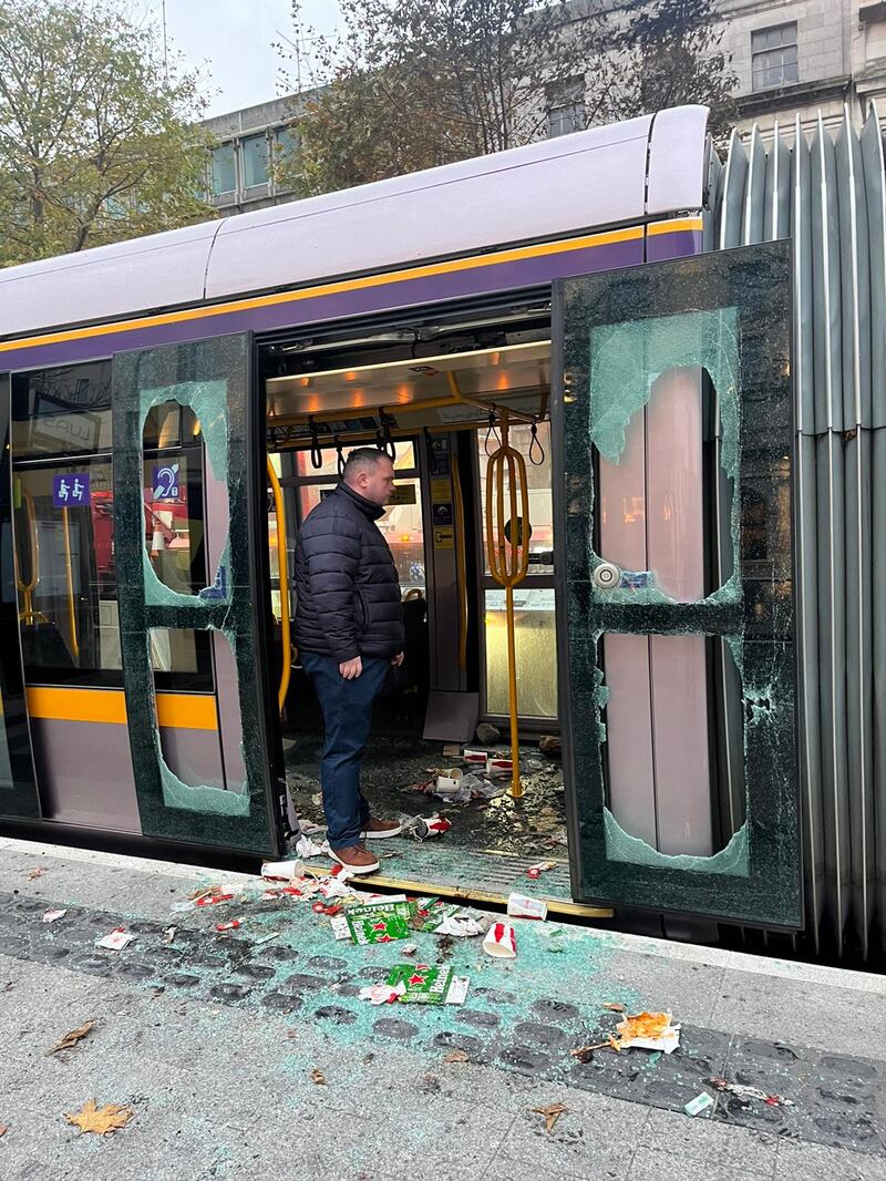 Dublin Lord Mayor Daithí de Róiste inspects a Luas in Dublin city centre the morning after it was vandalised during rioting . Photograph: Conor Pope